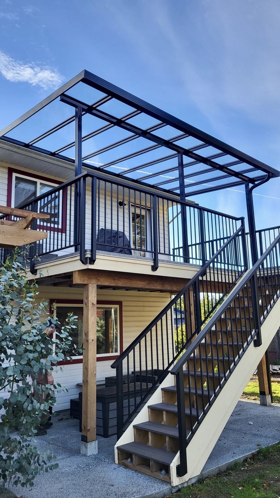 Upper deck with covered patio roof and stairs
