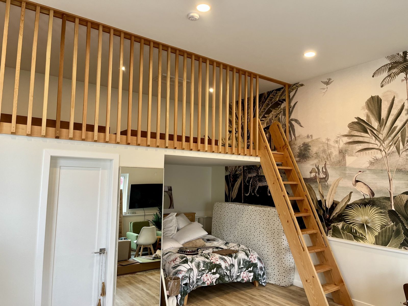 Loft with vertical wood railing