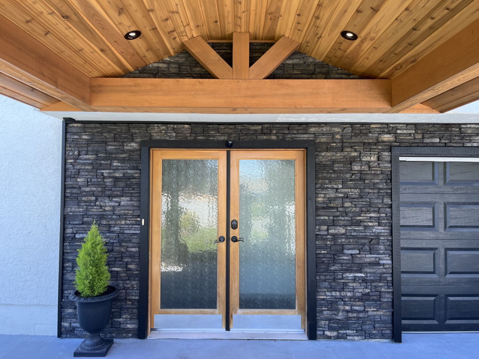 New entry doors with stone surround